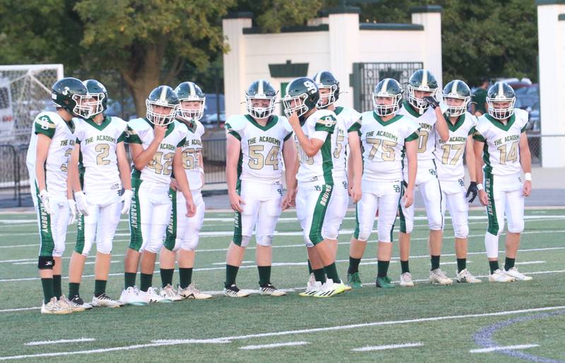 Members of the St. Bede football prepare to huddle as they get ready to play Tuscola on Friday, Aug. 25, 2023 at Tucci Stadium  in Bloomington.