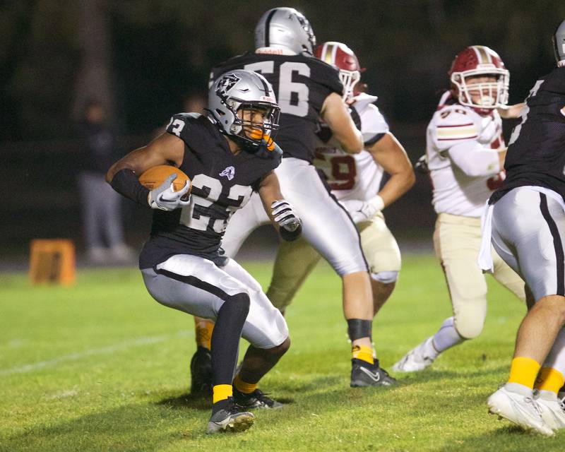 Kaneland's Aric Johnson runs for a gain against Morris on Friday, Sept. 8, 2023 in Maple Park.