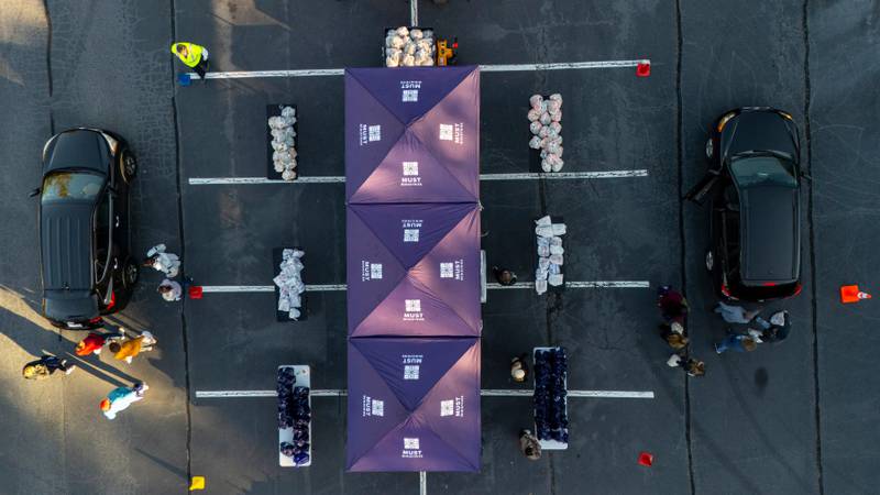 MUST Ministries delivers food to the public via a drive through service, Saturday, Nov. 1, 2025, in Austell, Ga. (AP Photo/Mike Stewart)