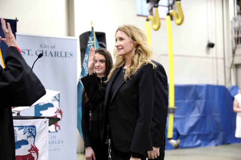 St. Charles Alderperson Vicki Spellman, surrounded by her family, is sworn in by Circuit Court Judge Susan Clancy Boles on Monday, May 5, 2025 at the St. Charles Fire Department.