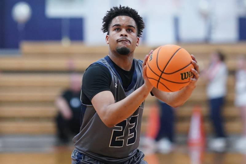 Oswego East's Torrin Ross (23) shoots a free-throw during a basketball game against Oswego at Oswego High School on Tuesday, February 18, 2025.