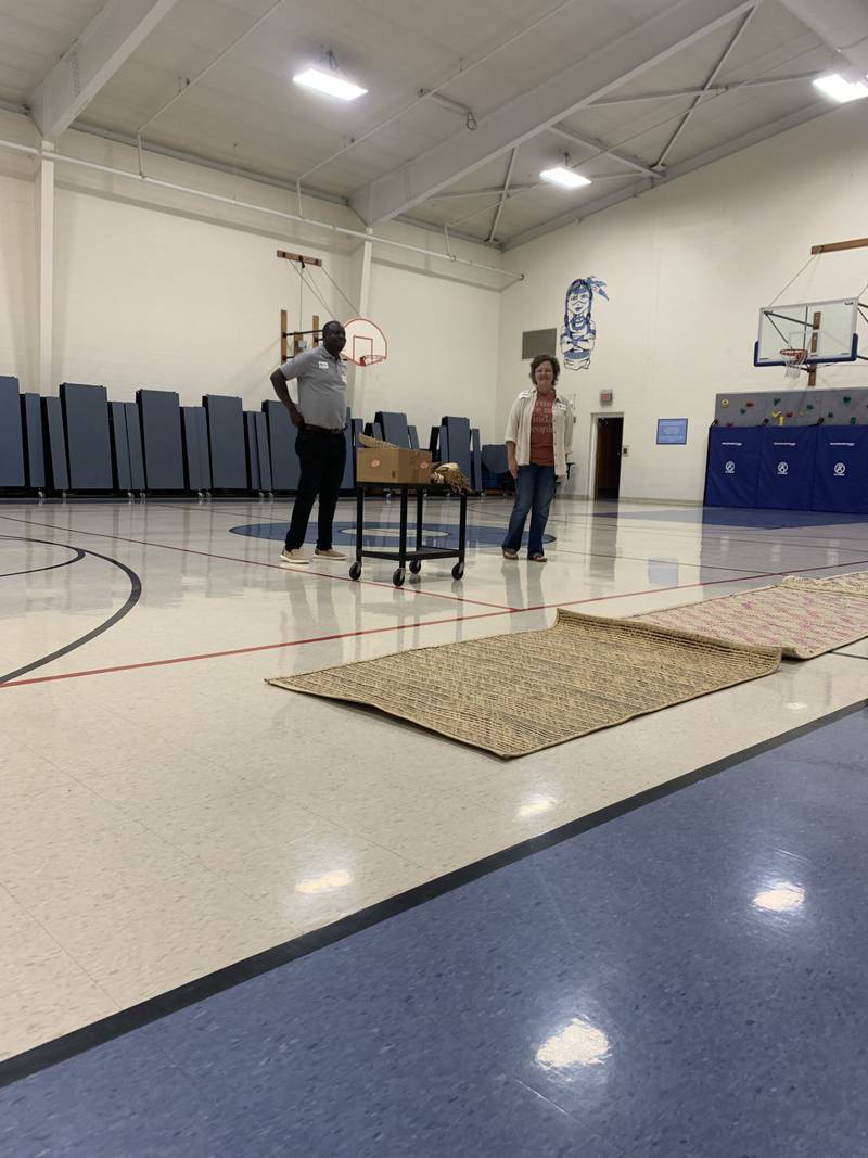 Milton Tusingwire and Nathalie Schmidt presented many different things from Uganda on Friday morning, including mats that children use as beds.