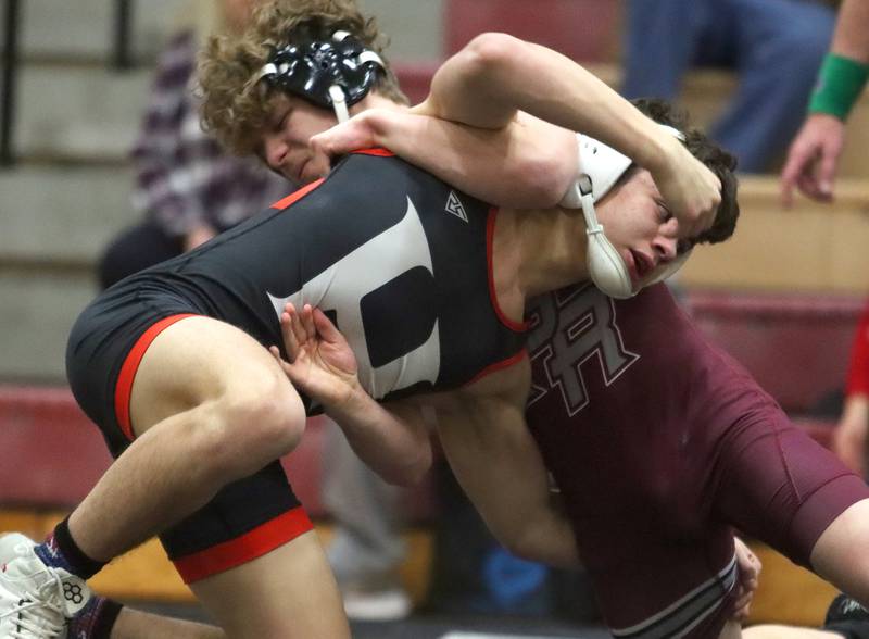 Huntley’s Gavin Nischke, front, battles Prairie Ridge’s Christian Pease at 138 pounds in varsity wrestling on Thursday, Jan. 23, 2025, at Huntley High School in Huntley.