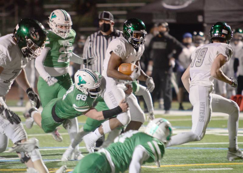 York's Fred Levins takes down Glenbard West's Jalen Moore during their home game March 26.