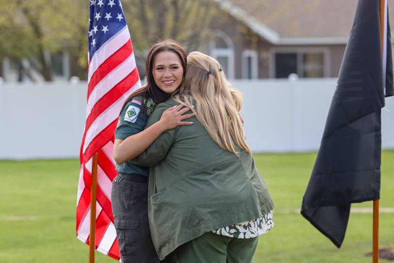 Alexis McCullough, left, hugs Karen Smietanski, Assistant Superintendent at the Veterans Assistance Commission of Kankakee County, during the McCullough Gold Star Families Memorial Monument dedication ceremony at Marcotte Park in Bourbonnais on Saturday, April 26, 2025.
