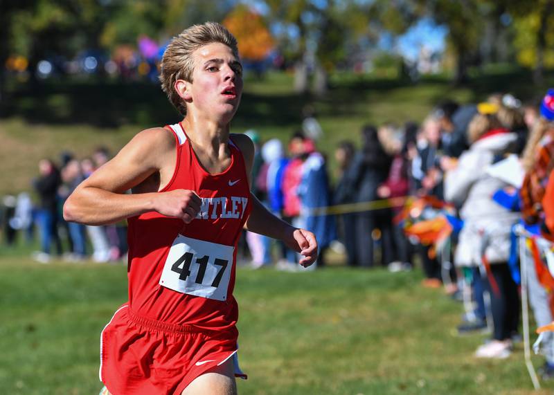 Huntley's Tommy Nitz crosses the finish line to finish first in the Fox Valley Conference boys cross country meet at Veteran Acres Park on Saturday, Oct. 15, 2022 in Crystal Lake.