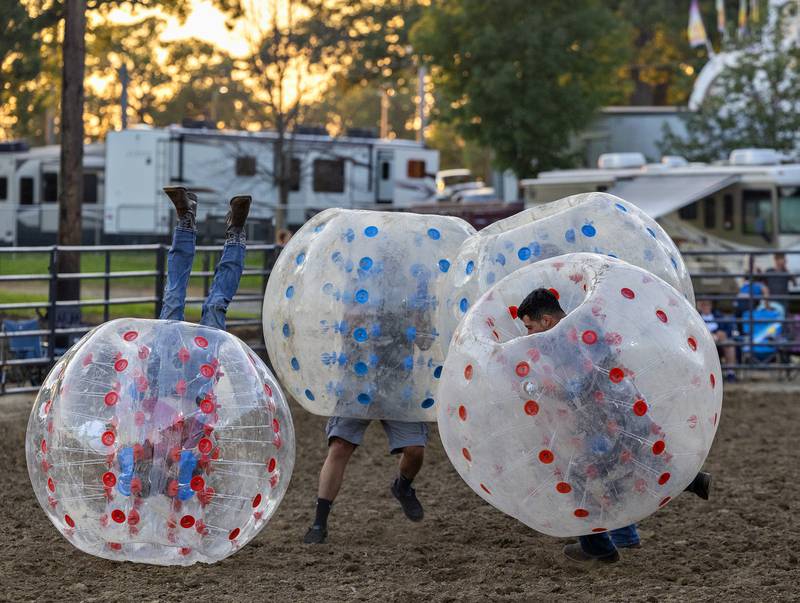 Competitors duke it out in a game of full contact bubble soccer Wednesday, August 13, 2025, at the Whiteside County Fair during the Next Level Pro Bronc rodeo.