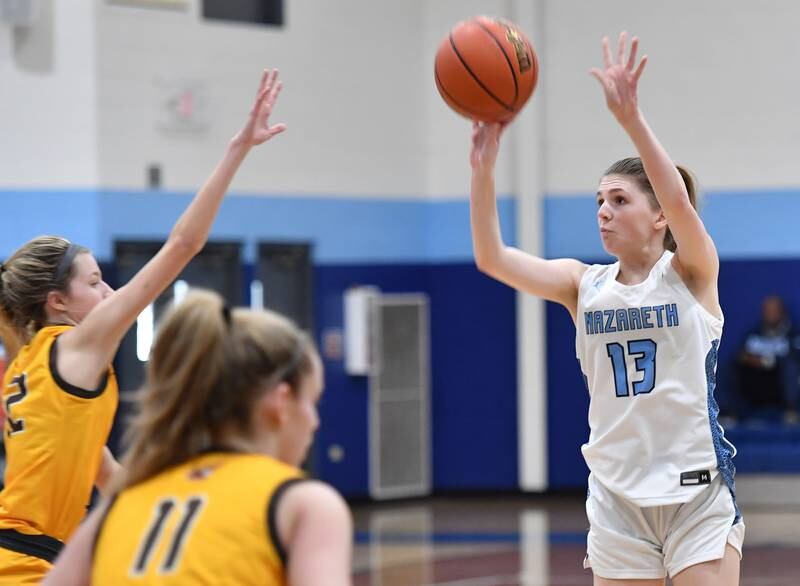 Nazareth's June Foley (13) shoots for three points during the ESCC conference tournament championship game against Carmel on Feb. 4, 2023 at Nazareth Academy in LaGrange Park.