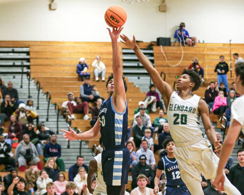 Nazareth's Kerem Tokdemir (50) puts in a shot during their Jack Tosh Holiday Classic basketball tournament game between Nazareth vs Glenbard West. Thursday Dec 26, 2024 in Elmhurst.