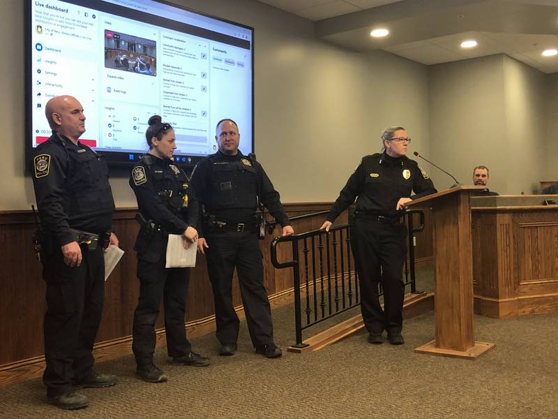 Peru police officers Brad Jones and Michelle Leary (left) are honored with a lifesaving award on Monday, Feb 13, 2023 at City Hall for their actions in saving a woman's life.