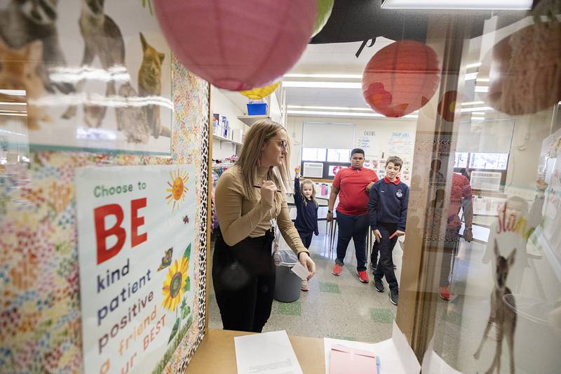 St. Mary School second-grade teacher Emily Conklen answers questions during the school’s scavenger hunt in recognition of Catholic School’s Week in Dixon.