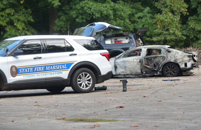 Dixon Rural firefighters and Lee County deputies were still on the scene late Thursday afternoon following a vehicle explosion in a parking lot at Lowell Park, north of Dixon, Thursday morning, Sept. 28, 2023. One person was found deceased in the driver's seat. Officials from the state fire marshal's office and the ATF also were called to the scene.