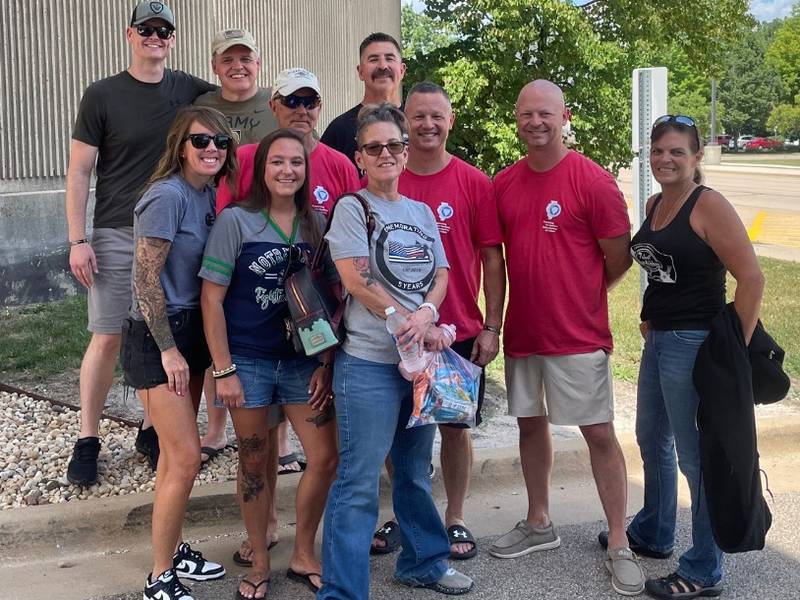 Personnel with the DeKalb County Sheriff's Office and others, including Sheriff Andy Sullivan (three from right), gather on Thursday, July 10, 2025, to depart on a nearly 400-mile bicycle ride from Champaign to Chicago for Cycle Across Illinois, a four-day charity ride honoring fallen law enforcement and supporting a nonprofit that helps their families.