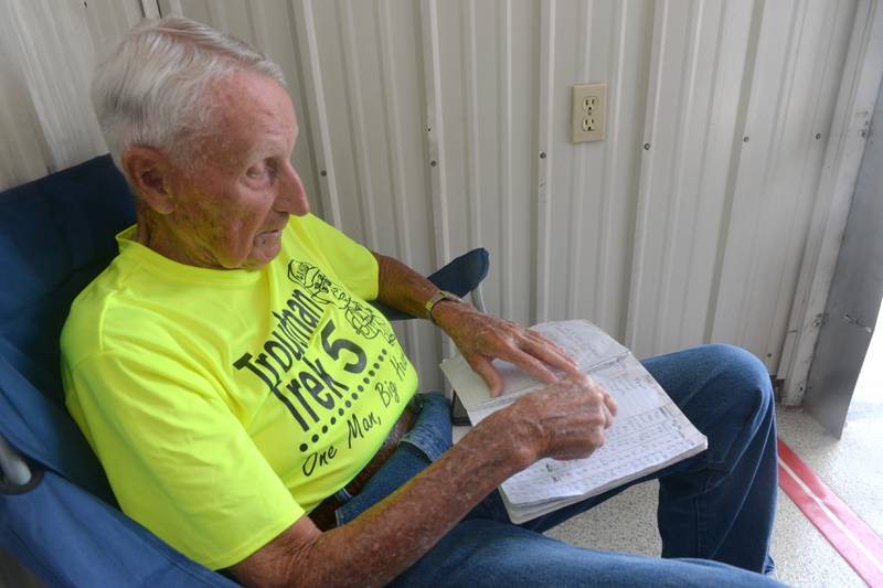 Dean Troutman shows his book where he keeps track of all the walks he has made for charity. Troutman, 92, of Princeville, Illinois, is walking 350 miles through our region to raise money for St. Jude's. He spent the night of June 3 at the Polo Ambulance Station.