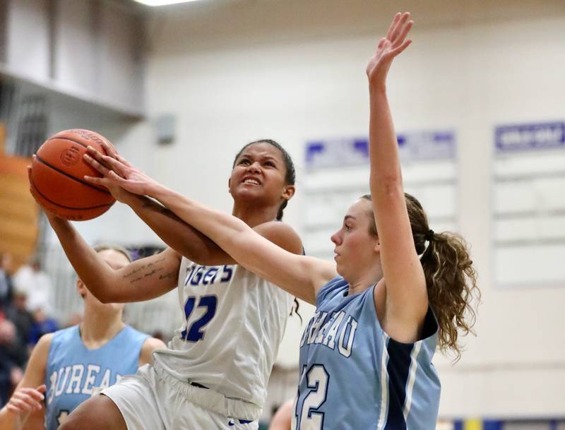 Princeton's Mariah Hobson drives on Bureau Valley's Kate Stoller Thursday night at Prouty Gym. The Tigresses won 48-34.