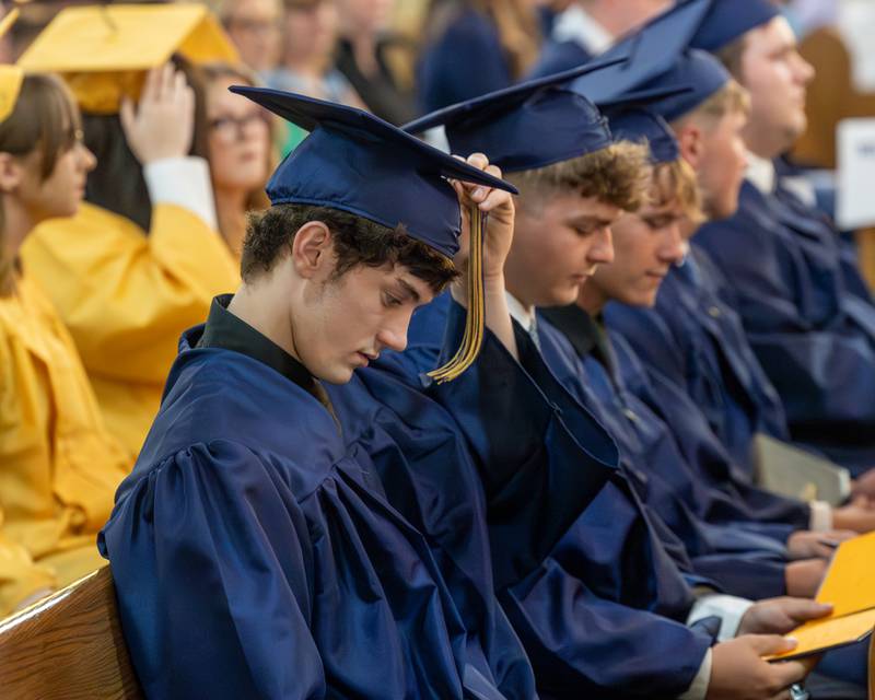 Class of 2026 Marquette Academy Graduate moves tassel on cap during ceremony on May 24, 2026 at St. Columba Church in Ottawa.