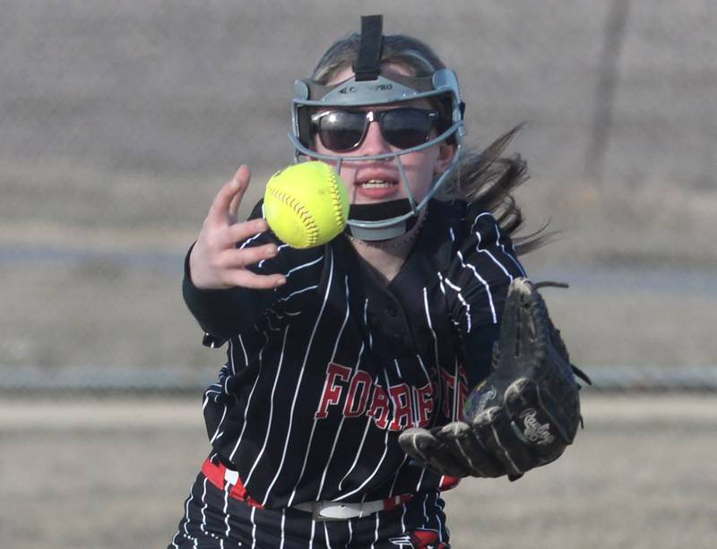 Forreston second baseman Nevaeh Scheffner keeps her eye on the ball as it bounces into the air while fielding a grounder against River Ridge/Scales Mound on Monday, March 24, 2025 in Forreston.