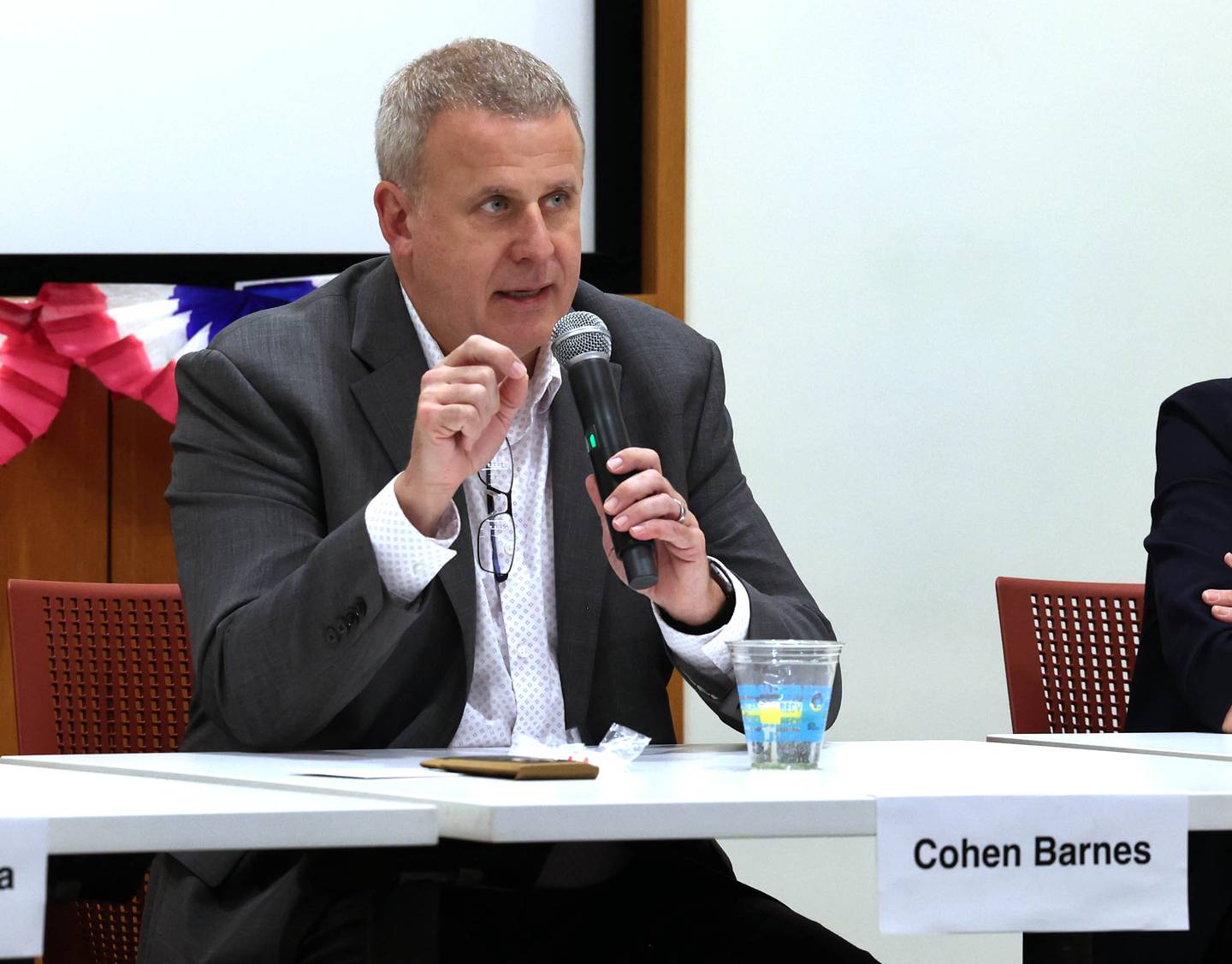 Democratic candidate Cohen Barnes, who is vying for the nomination for the 76th district seat in the Illinois House of Representatives, answers a question Saturday, Feb. 3, 2024, in a meet the candidates forum at the DeKalb Public Library. Democratic candidates Amy Murri Briel and Carolyn Zasada also spoke at the event organized by DeKalb Stands and co-sponsored by the DeKalb County Democrats.