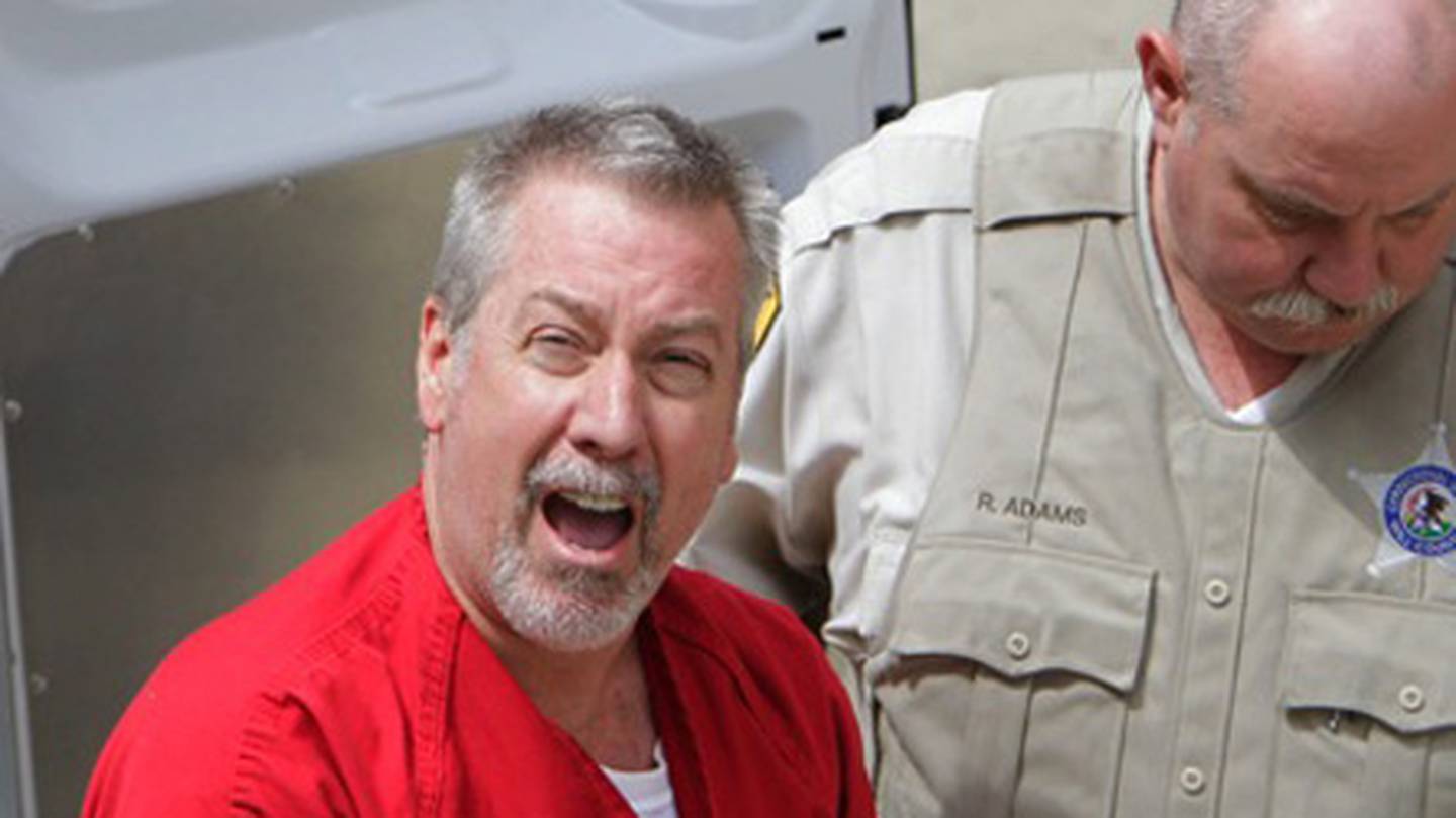 In this May 8, 2009 file photo, former Bolingbrook, Ill., police sergeant Drew Peterson yells to reporters as he arrives at the Will County Courthouse in Joliet, Ill., for his arraignment on charges of first-degree murder in the 2004 death of his former wife Kathleen Savio. In his first media interview since being arrested, Peterson defended his cavalier attitude after his arrest on charges of killing his third wife. Speaking by phone from the Will County Jail, Peterson told NBC's Matt Lauer on the Friday, May 15, 2009, "Today" Show that he deals with stressful situations with humor. (AP Photo/M. Spencer Green, File)