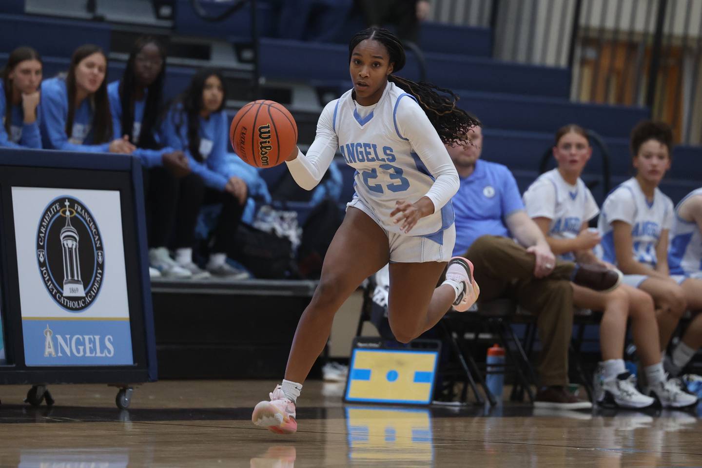 Joliet Catholic’s Symone Holman takes the ball upcourt against Lincoln-Way Central in the 2023 WJOL Girls Basketball Tournament on Monday, Nov. 13, 2023, in Joliet.