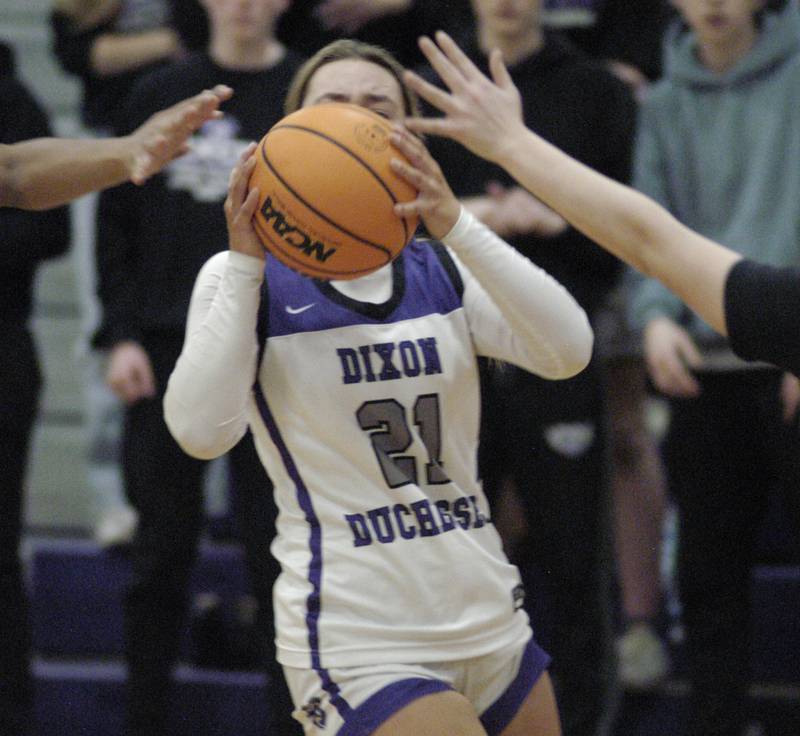Dixon's Reese Dambman is defended by two Byron players. The Dixon Duchesses hosted Byron in girls basketball Saturday, Jan. 25, 2025.