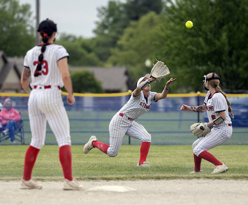 Fulton’s Zoe Kunau comes in to make a catch in center against Morrison Friday, May 22, 2026, at the Class 1A softball regional at Newman High School.