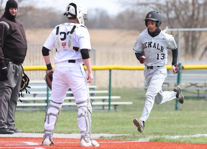 DeKalb's Ethan McCarter crosses the plate to score a run during their game against Kaneland Friday, April 15, 2022, at Kaneland High School in Maple Park.