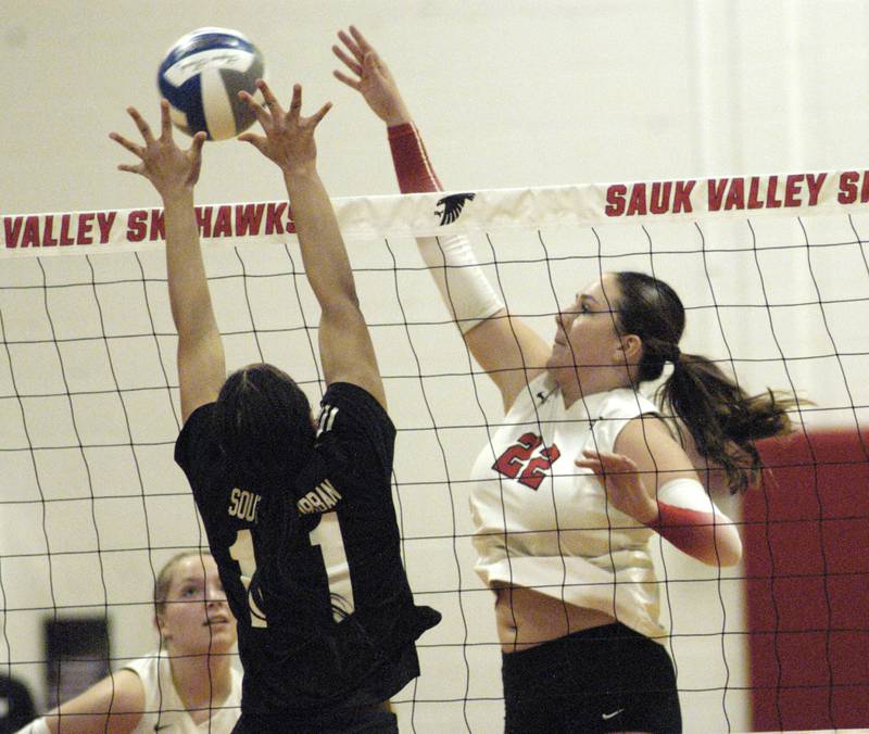Skyhawk player ReAnna Brant hits the ball past defender Samiya Smith. Sauk Valley College beat South Suburban College in three sets Wednesday, November 6, 2024 at Sauk Valley Community College.