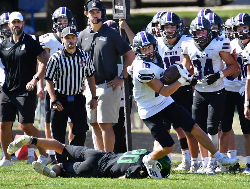 Downers Grove North's Oliver Thulin (10) slips away from Glenbard West's Joey Campanella during a game on Sep. 9, 2023 at Glenbard West High School in Glen Ellyn.
Jon Cunningham for Shaw Local News Network