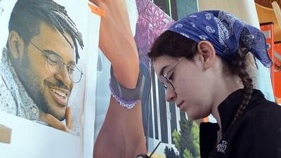 2 IVCC alums work to bring college history mural to life 