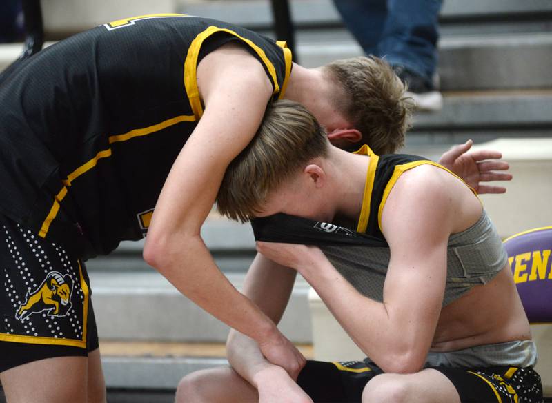 Riverdale's Jackson Tegeler (left), a freshman, consoles Jake Willems, a senior, in the final seconds of the Rams' loss to Byron at the 2A Mendota Sectional on Wednesday, Feb. 28, 2024. Willems ked the Rams in scoring with 19 points in the 70-51 loss.