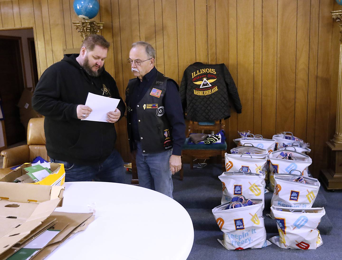 Tim Dempsey and Jim Wojtysiak talks about how they and other members of the Wauconda Masonic Lodge #298 will deliver the bags of groceries on Monday, Dec. 18, 2023, to about 45 McHenry County families, so they will have food for Christmas.