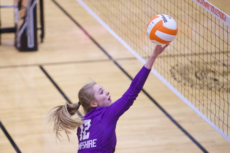Hampshire's Sam Freemen looks to keep the volley alive against McHenry on Tuesday, Sept. 6,2022 in McHenry.