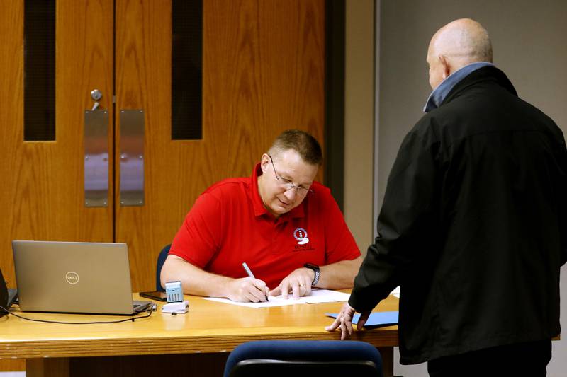 Steve Doherty files his paperwork Tuesday, Nov. 12, 2024, to run for Ward 3 alderman with McHenry Deputy Clerk Monte Johnson during first day of filing for the consolidated election on April 1, 2025.