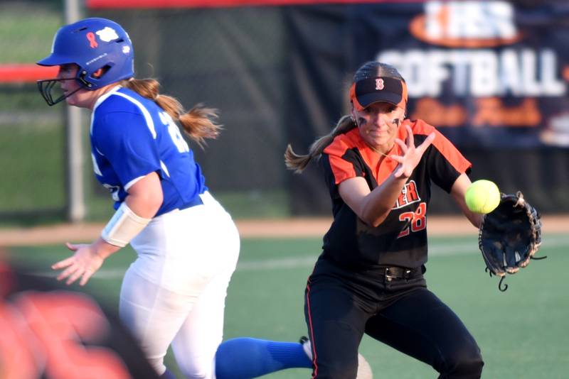 Beecher's Ava Olson, right, attempts to field a ball as Auburn's Skylar Meats runs towards third base during the Class 2A State semifinals at the Louisville Slugger Complex in Peoria Friday, June 6, 2025.