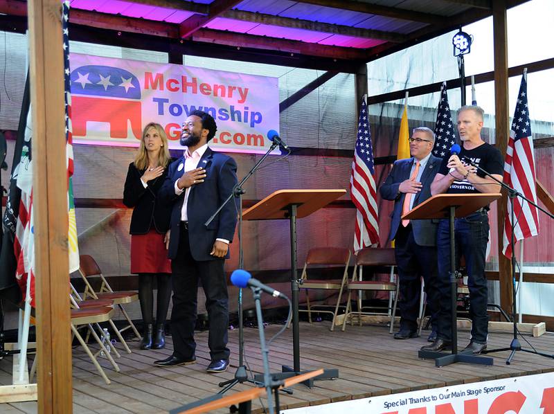 Republican lieutenant governor candidate Carolyn Schofield, who was filling in for her running mate of Republican gubernatorial candidate Paul Schimpf, and Republican gubernatorial candidates Max Soloman, Darren Bailey, and Gary Rabine, say the Pledge of Allegiance during the Grand Old Party at the Farm Forum on Saturday, June 4, 2022, at Richardson Farm, 909 English Prairie Road, in Spring Grove. The all day event forum featured Republican candidates up and down the ticket on multiple stages.