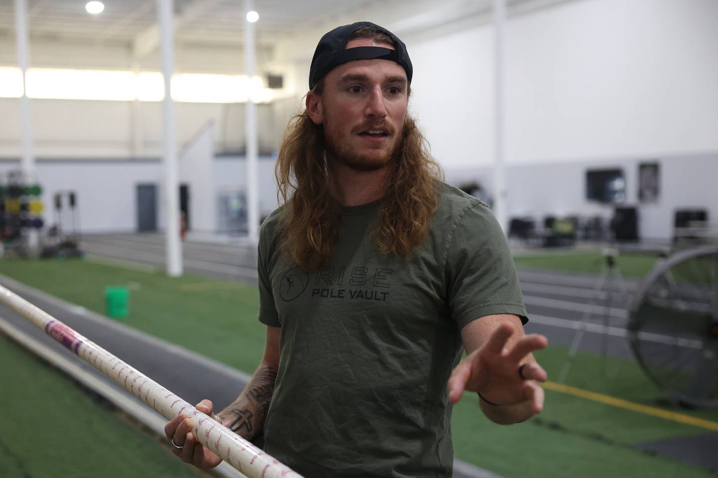 Luke Winder talks about the science behind stored energy that pole vaulters use to achieve greater jumps at the Rise Pole Vault training facility on Wednesday, May 29, 2024 in Joliet. Luke will be competing in the U.S Olympic trials in June, where the top three pole vaulter with my the Olympic team.