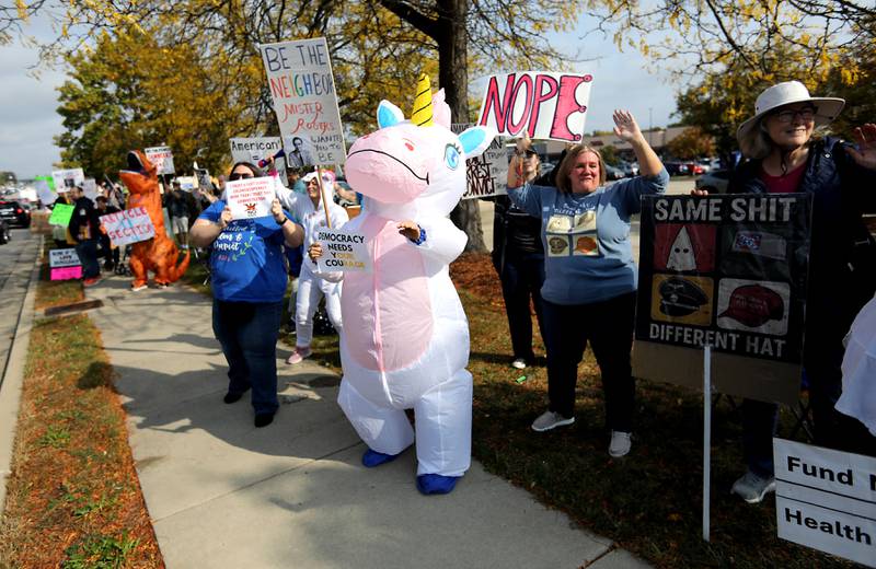 Protesters line Route 31 during a "No Kings” protest rally on Saturday, Oct. 18, 2025, in McHenry. The protest drew thousands of protesters to the area to protest the policies of President Donald Trump.