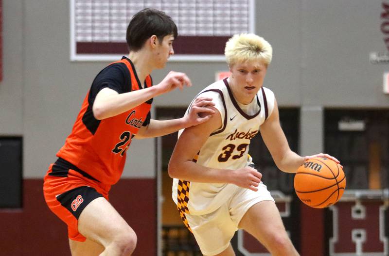 Richmond-Burton’s Luke Robinson, right, drives against Crystal Lake Central’s Aidan Watson in varsity boys basketball E.C. Nichols tournament championship game action on Saturday, Dec. 27, 2025, at Homer “Bill” Barry Gymnasium on the campus of Marengo High School in Marengo.