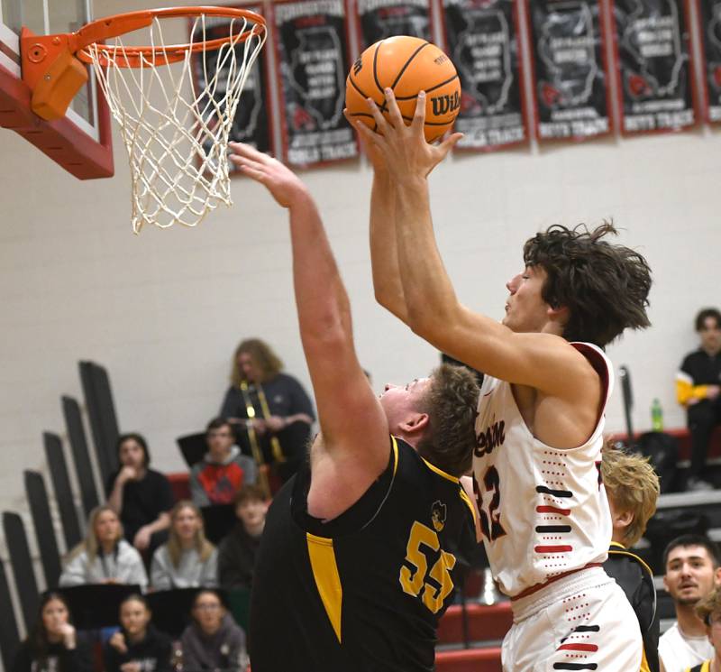 Forreston's Jonathan Milnes (32) shoots over AFC's Lane Messer on Saturday, Jan. 17, 2026 at Forreston High School.