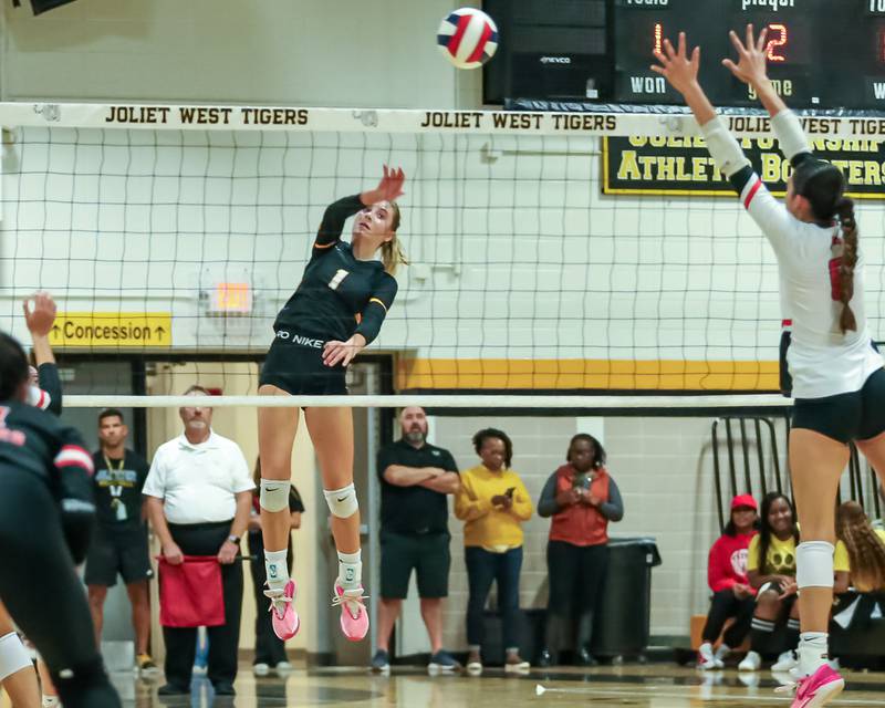 Joliet West's Ava Grevengoed (1) smashes a kill during regional final volleyball match between Bolingbrook at Joliet West.  Oct 26, 2023.