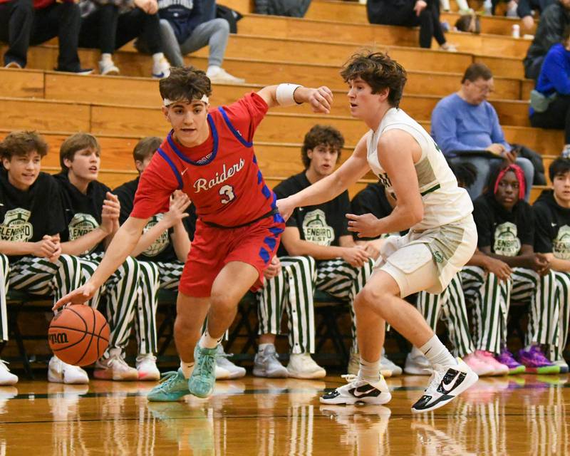 Glenbard South's Angjelos Salca (3) drives to the basket while Glenbard West's Bennett Schwnanke (22) plays defense during the first quarter on Monday Nov. 20, 2023 during the district 87 Invite held at Glenbard West.