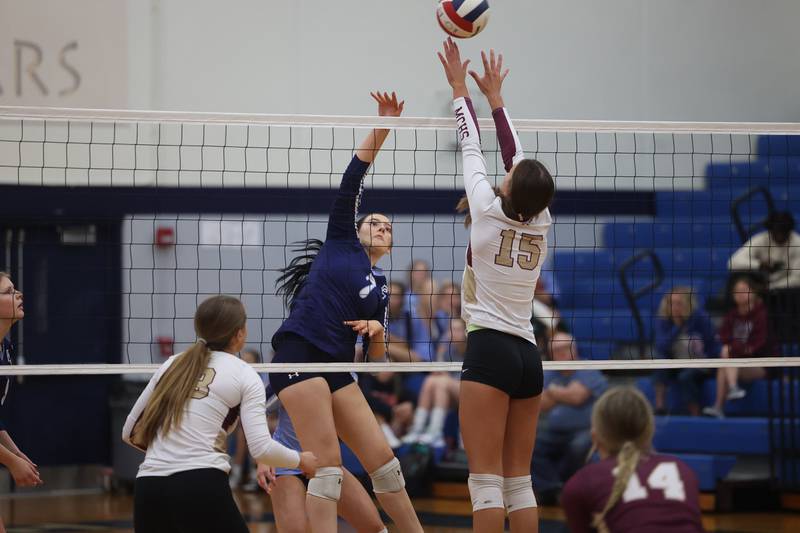 Plainfield South’s Alexi Barth hits a shot over the arms of Morris’ Lily Hansen on Monday, Sept. 25, 2023 in Plainfield.