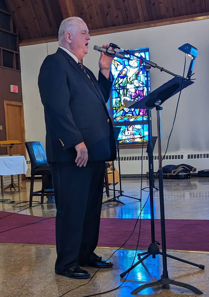 Mark Mench, a student of Mardi Huffstutler, sings during the Woodlawn Arts Academy winter music recital at St. Paul Lutheran Church, Sterling.