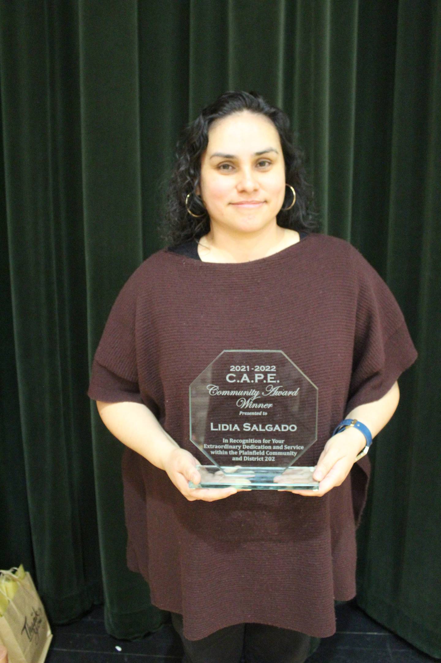 Thomas Jefferson Elementary School ESL teacher Lidia Salgado shows off her 2021-2 CAPE Community Award.