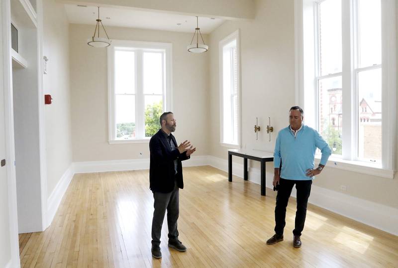 Woodstock City planner Darrell Moore and Mayor Mike Turner talk about the newly remodeled Old Courthouse Center in Woodstock on Thursday, July 13, 2023, during a tour of the building.