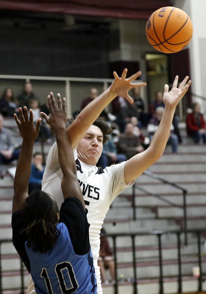 Prairie Ridge's Tommy Meehan pass the ball as he is pressured by Illinois Math & Science Academy's Benjamin Dixson during a IHSA Class 3A Burlington Central Regional quarterfinal boys basketball game on Monday, feb23, 20256, at Prairie Ridge High School in Crystal Lake.