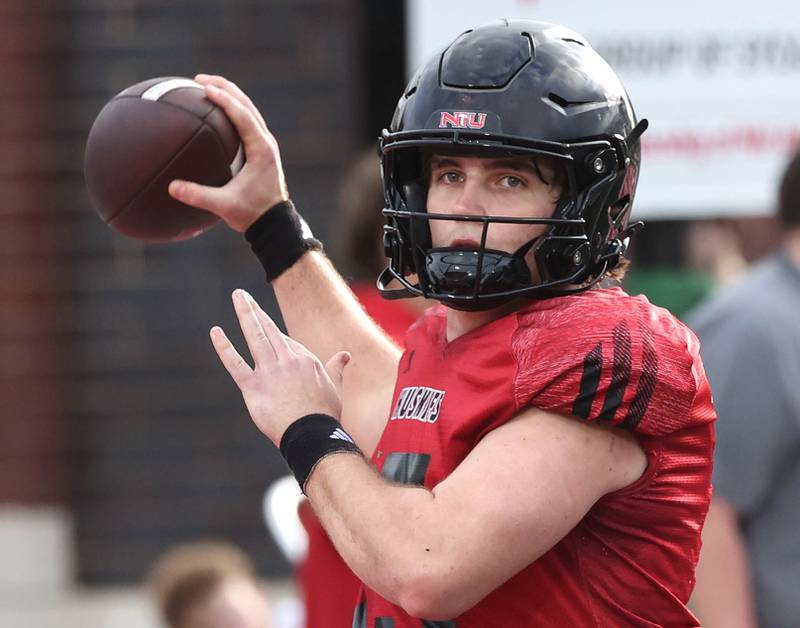 Northern Illinois University quarterback Ean Hamric throws a pass Tuesday, April 14, 2026, during a drill at spring practice in Huskie Stadium at NIU in DeKalb.