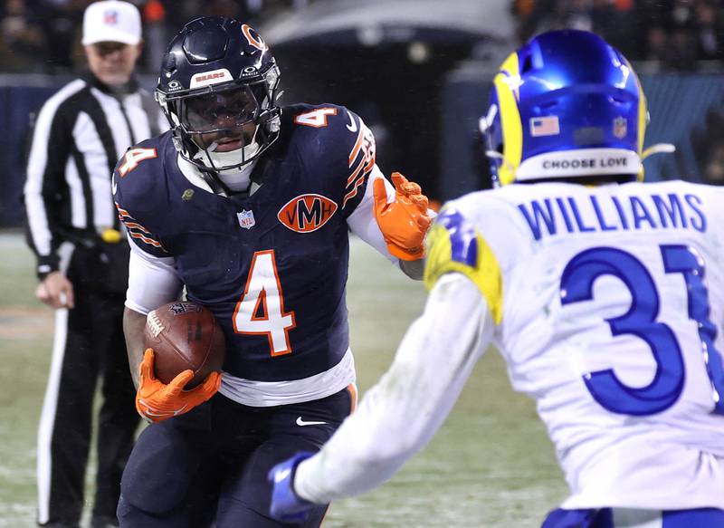 Chicago Bears running back D'Andre Swift looks to get by Los Angeles Rams cornerback Darious Williams Sunday, Jan. 18, 2026, in their NFC divisional playoff matchup at Soldier Field in Chicago.
