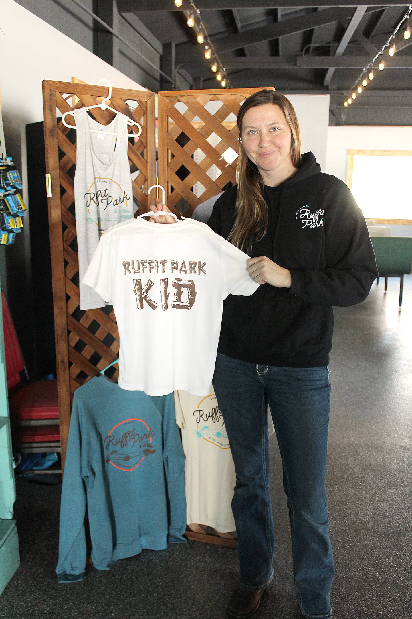 Molly Habben has heard many stories of campers who once had fun at Ruffit Park and now bring their children or grandchildren to experience the same. Shirts, such as this one for those who are "Ruffit Park kids" are also sold at its store.